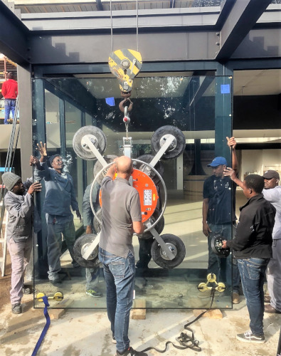 Workers installing aluminium double doors